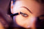 Applying eyeliner to a dry winter eye area after smooth concealer and eye prep